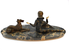 Medium sized "Chryselephantine" lady with Borzoi (Russian wolfhound), mounted on a Portoro marble base by Scali, France 1930s. Spelter and Ivoreen. Overall length 49 cm  19.30".