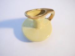 Small Yellow Pitcher with a Gold lining on handle,  7,7 cm  3" tall.   Southern Pottery 1955, Erwin Tennessee USA.