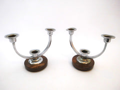 Pair of Art Deco Candle-stands. Each with circular dark brown wooden Support and 3 chromed Candleholders.