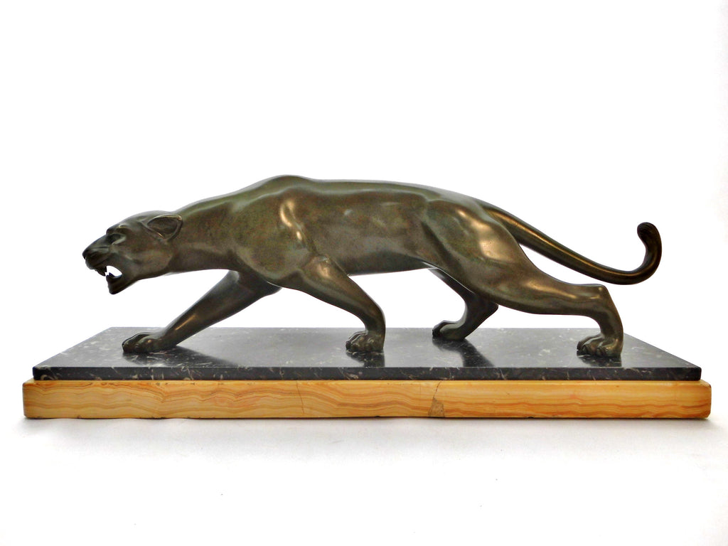 Elegant, stylish Bronze Panther by Salvatore Melani (Italy1902-1934). Massive green patinated Bronze. Mounted on a Base with 2 kinds of Marble. France 1920s.