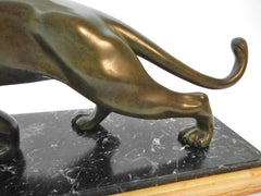 Elegant, stylish Bronze Panther by Salvatore Melani (Italy1902-1934). Massive green patinated Bronze. Mounted on a Base with 2 kinds of Marble. France 1920s.