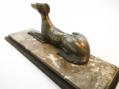 Elegant Borzoi Dog in Brass Alloy by Salvatore Melani (Italy 1902-1934). Mounted on a Two-layer Base of Iron & Marble. France 1920s.