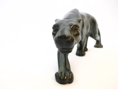 Elegant crouching Panther ready to strike, created by Secondo in France around 1930. Bronze, finished with a green patina.