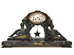 Impressive Clock in green patinated Spelter on a Portoro Marble Base. Designed by the famous Belgian Sculptor Georges Van de Voorde. This Masterpiece named "L'Etoile" (Star) was presented at the select "Salon des Artistes Français" in Paris around 1920.